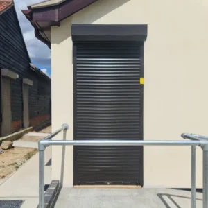 Callisto Continental Shutters for Entrance Security. This example shows a dark brown Callisto Shutter securing a single door.