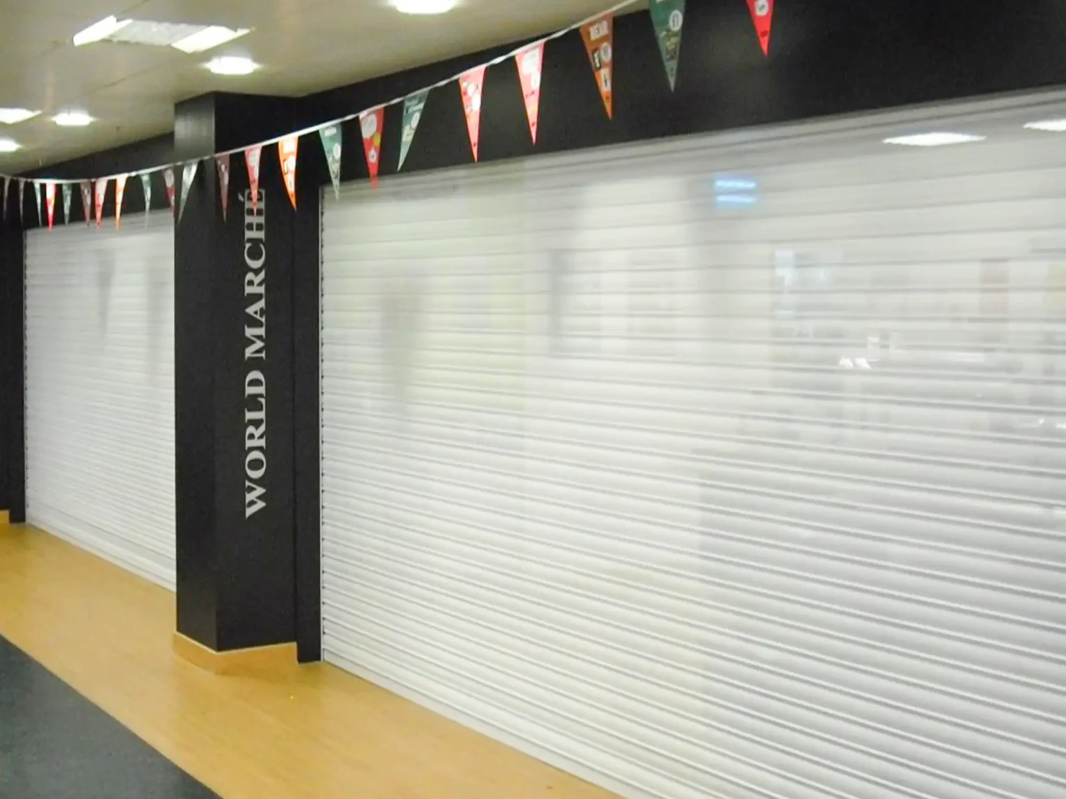 Ultradoor white shutters fitted to a food court outlet