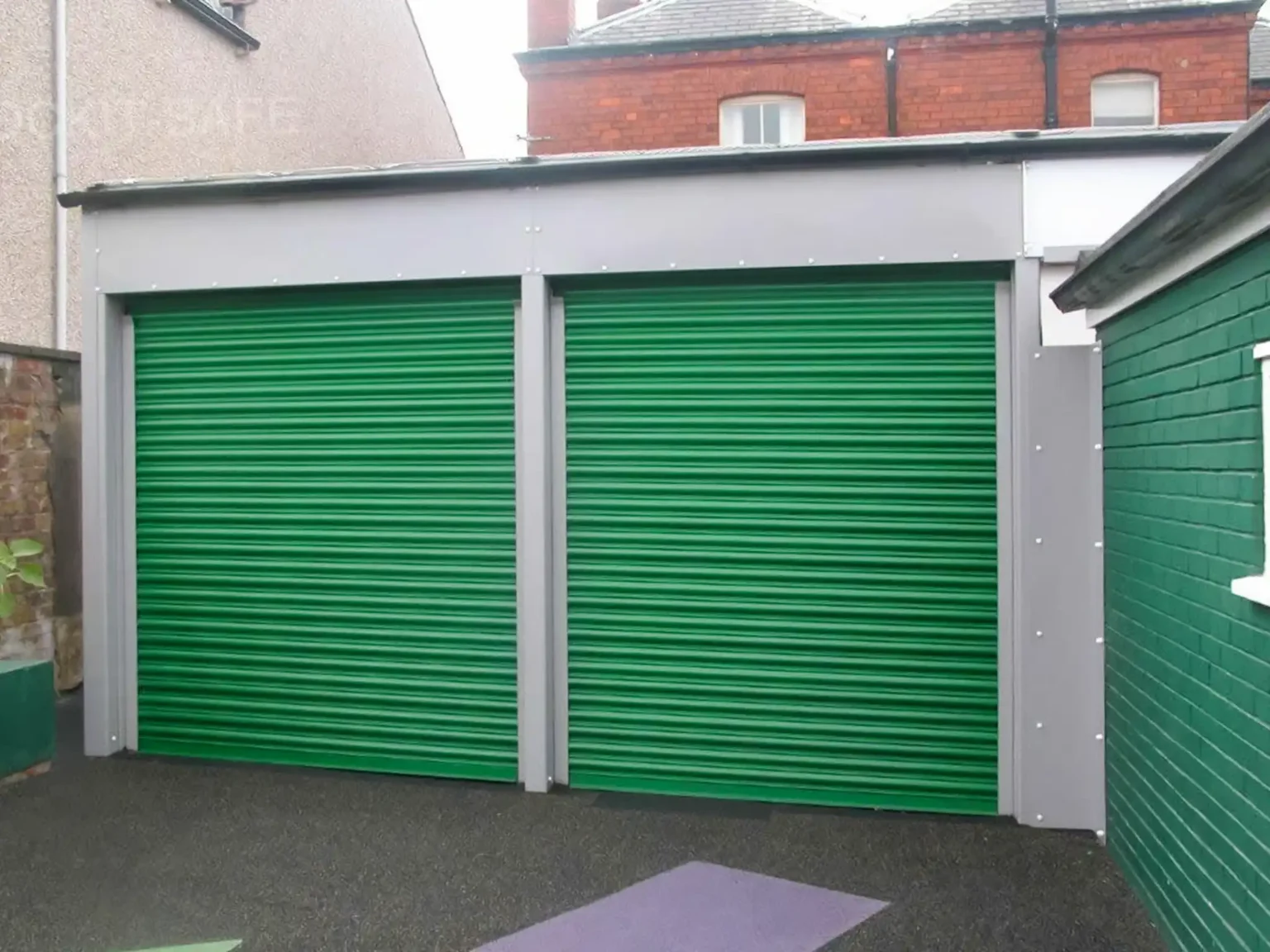 Twin Titan push up Roller Shutters fitted in a school yard